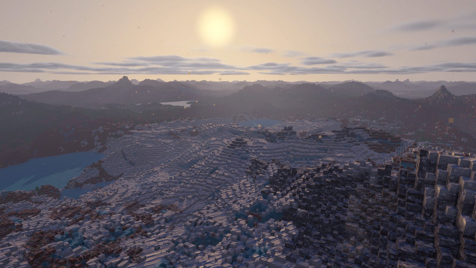 Snow-covered voxel slopes and a mountain-lake wilderness at sunrise — the unexplored side of the map players keep asking about